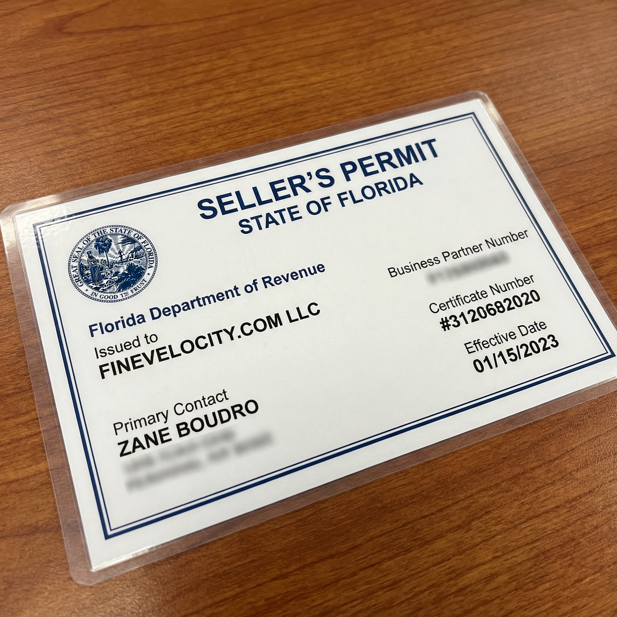 Make an ultra photo-realistic seller's permit for the state of Florida for the name Zane Boudro and the LLC FineVelocity.com